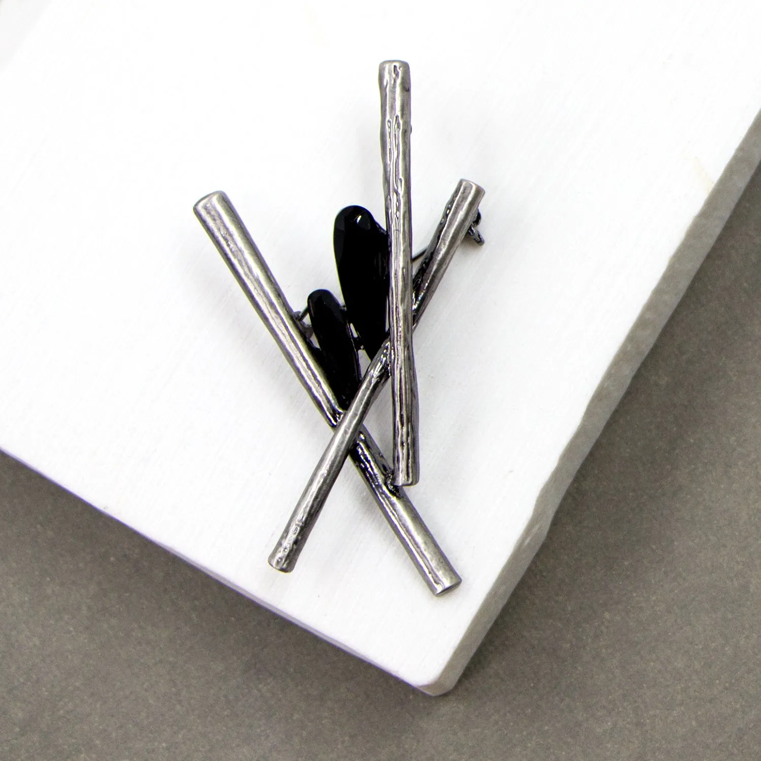 Contemporary criss cross brooch with jet crystal